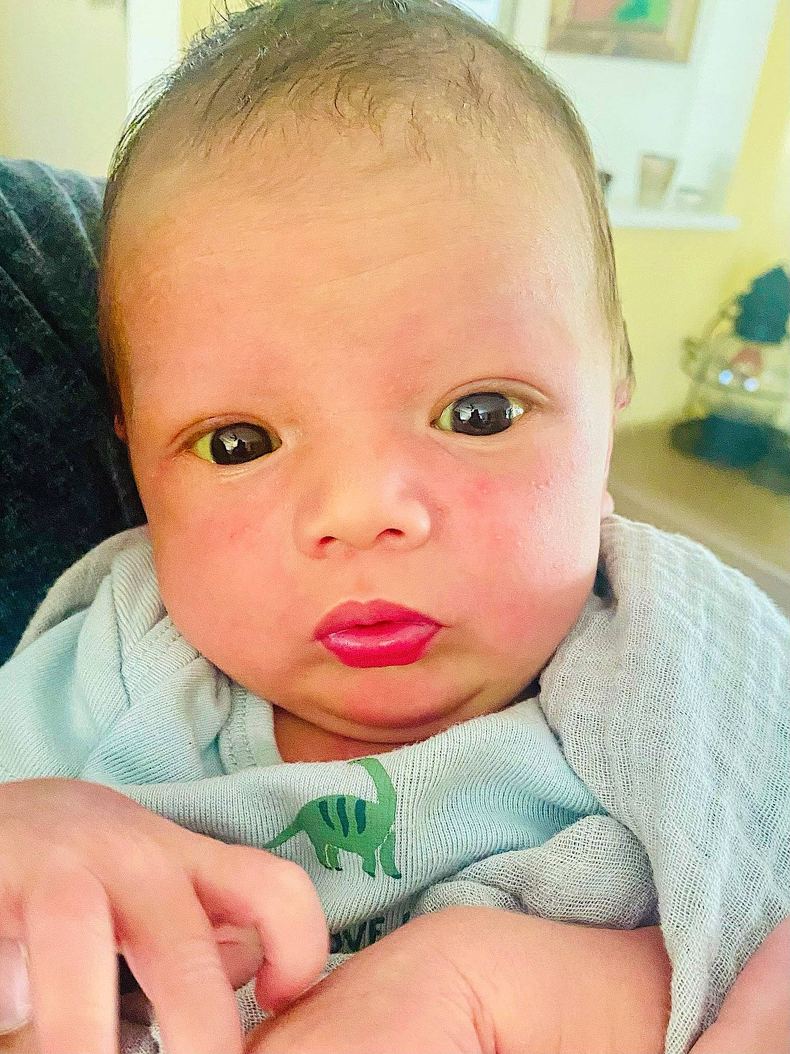 Elias is registered to the contest to win money with this photo: baby, baby_products, baby_toddler_clothing, cheek, child, comfort, ear, eyebrow, eyelash, finger, gesture, happy, iris, linens, lip, nail, nose, person, skin, thumb