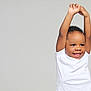 Tymair is registered to the contest to win money with this photo: child, toddler, smiling, white_tshirt, arms_up, happy, portrait, cute, face, expression, studio, background, isolated, young, boy, short_hair, skin, person, casual_clothing, indoor