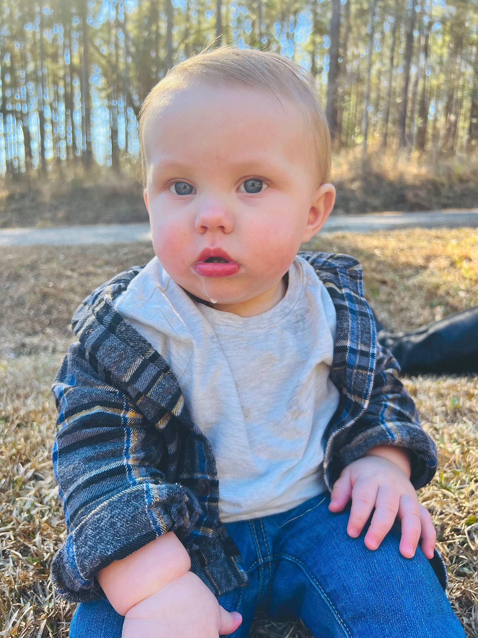 Kash is registered to the contest to win money with this photo: baby, baby_toddler_clothing, blond, blue, child, electric_blue, grass, happy, iris, leaf, lip, pattern, people_in_nature, person, plaid, plant, skin, t_shirt, toddler, tree