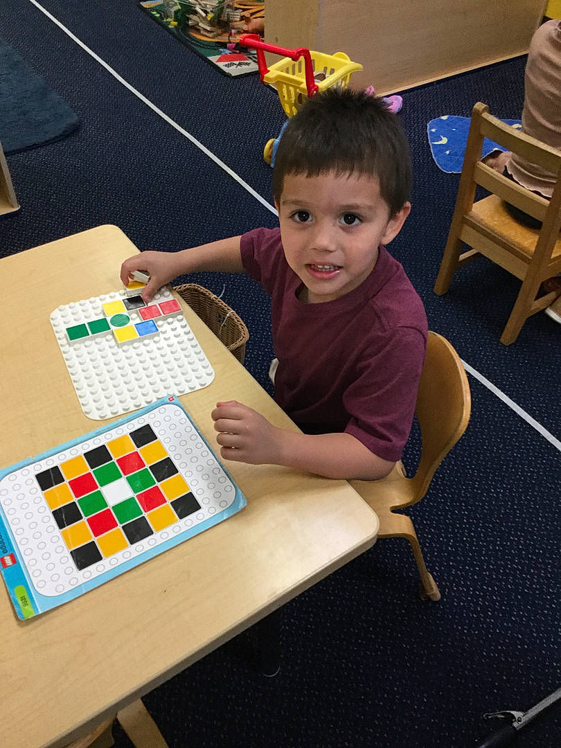 Jacob joined the competition — help win amazing prizes! chair, child, desk, educational_toy, engineering, event, fun, furniture, indoor_games_and_sports, leisure, person, play, puzzle, recreation, room, sharing, t_shirt, table, toddler, toy