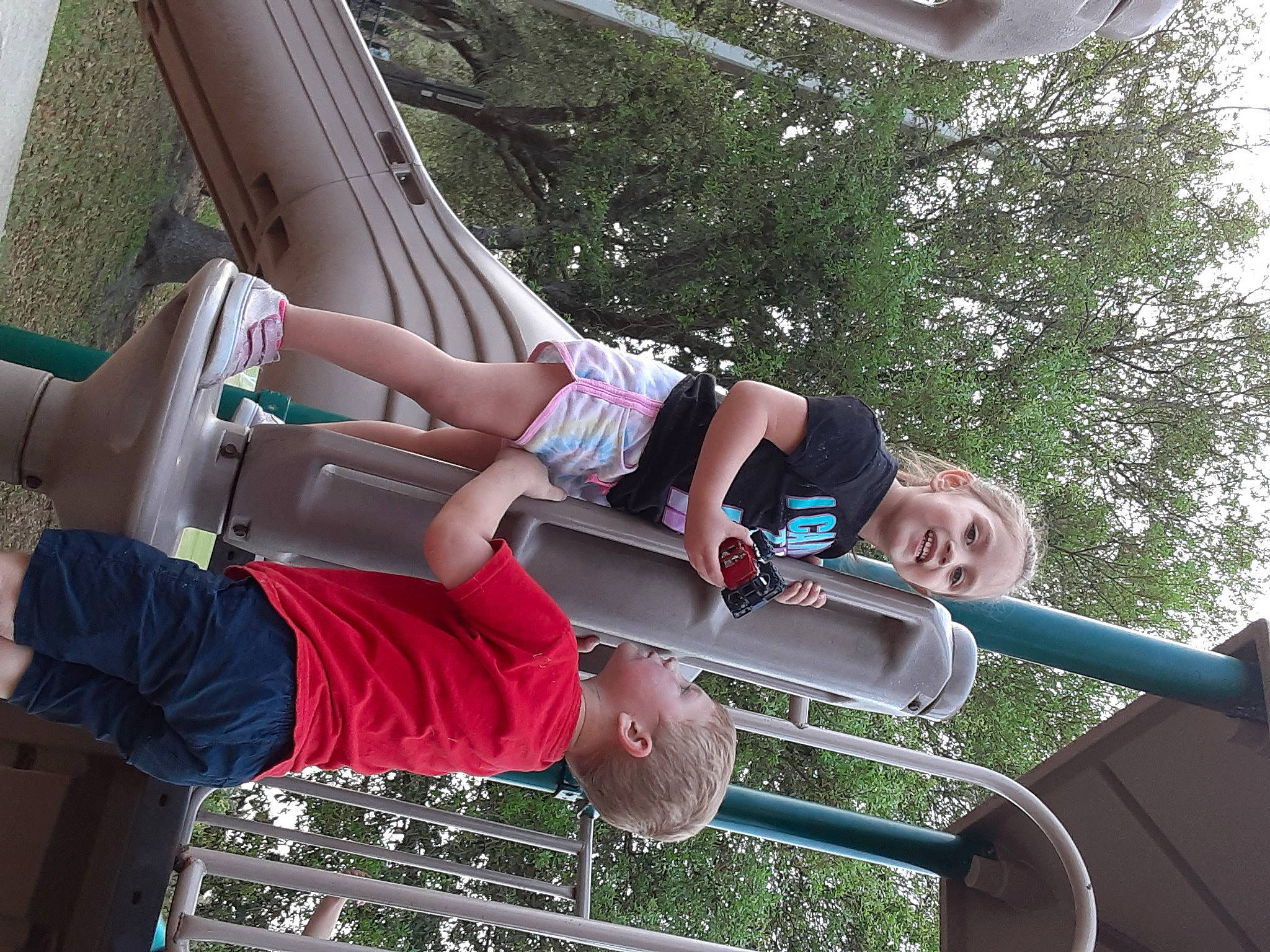 Sofia joined the competition — help win amazing prizes! automotive_exterior, elbow, electric_blue, fun, human_leg, leisure, magenta, person, recreation, shorts, sky, t_shirt, thigh, tree, vacation, vehicle_door, walking_shoe, white