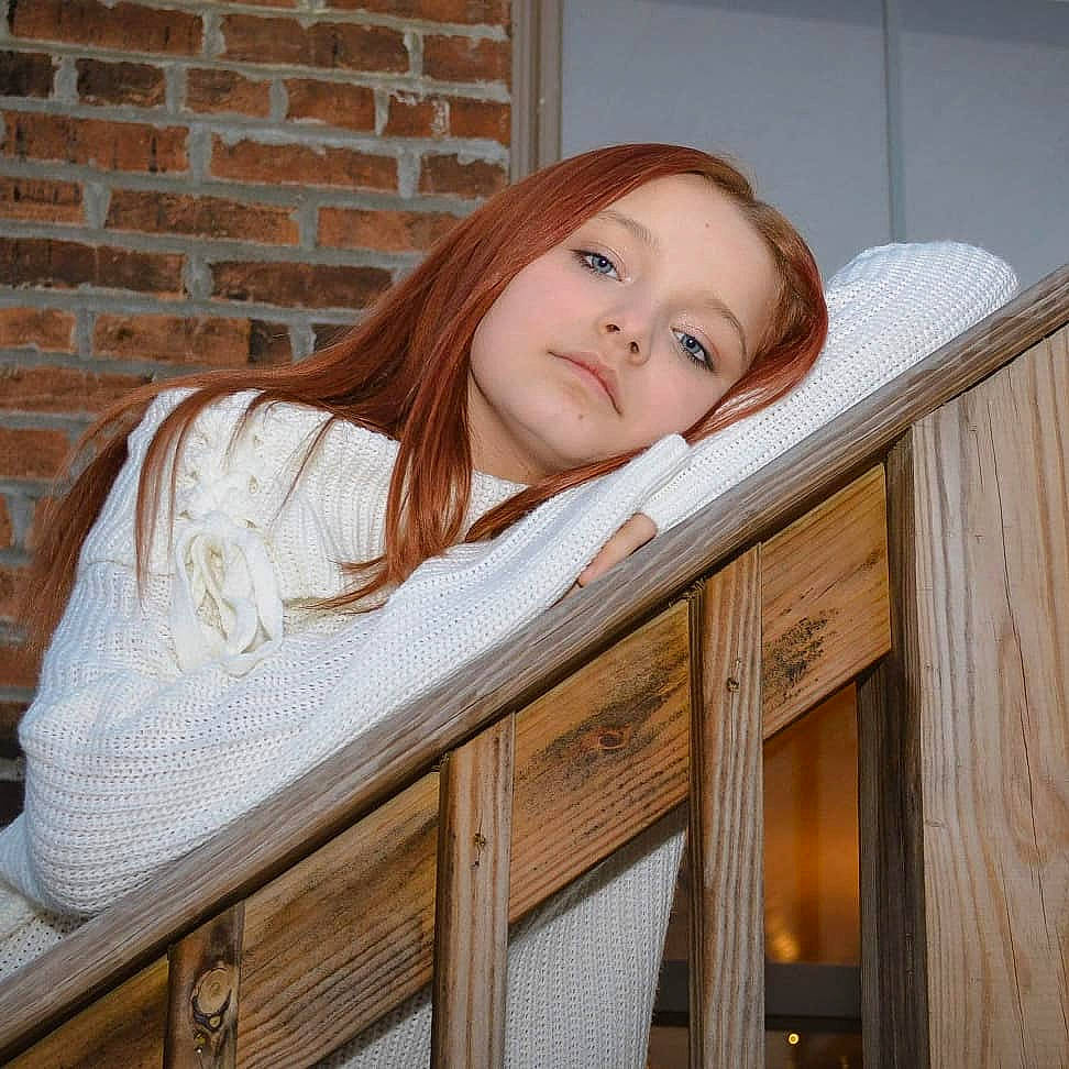 Summer is registered to the contest to win money with this photo: bench, brick, brickwork, brown_hair, chair, child, chin, comfort, drawer, eye, hardwood, head, house, long_hair, person, room, sitting, toddler, varnish, wood