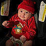 baby, infant, car_seat, red_hat, red_sweater, holiday_clothing, cute, smiling, child, indoors, seat_belt, toddler, plush_bear, christmas, festive, adorable, clothing, face, person, young_child