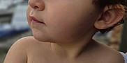 Morrison is registered to the contest to win money with this photo: child, toddler, face, profile, closeup, skin, hair, hand, fingers, outdoor, natural_light, portrait, young, curly_hair, expression, looking_away, soft_focus, baby, person, cute