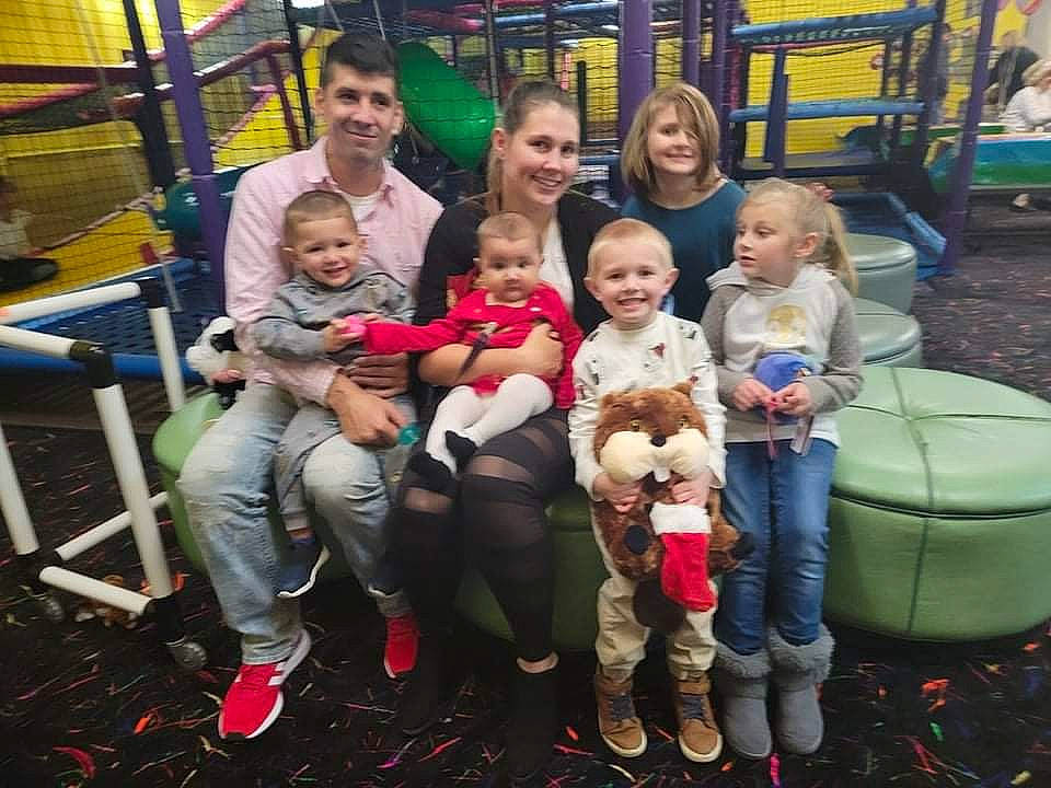 Neil is registered to the contest to win money with this photo: baby, child, event, face, fun, happy, head, jacket, jeans, joy, lap, leisure, mammal, person, playground, skin, smile, sneakers, social_group, toddler