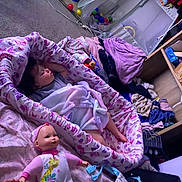 Raealyn joined the competition — help win amazing prizes! baby, bedroom, blanket, carpet, child, clutter, cozy, doll, floor, furniture, indoor, infant, nursery, onesie, pink, purple, resting, sleeping, soft_toys, toy