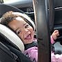 Analaiah is registered to the contest to win money with this photo: baby, child, car_seat, car_interior, smiling, curly_hair, pink_clothing, butterfly_pattern, seatbelt, happy, infant, safety, cute, portrait, young_child, car, child_safety, toddler, child_in_car, joyful