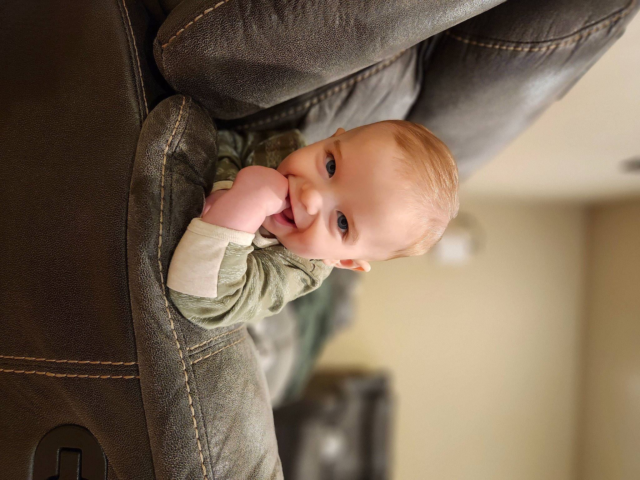 Dawson is registered to the contest to win money with this photo: baby, baby_toddler_clothing, cheek, chin, comfort, eye, face, finger, flash_photography, hand, happy, head, human_body, lip, mouth, nose, person, skin, sleeve, smile