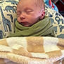 Jason joined the competition — help win amazing prizes! newborn, baby, sleeping, blanket, pillow, animal_print, green_blanket, cozy, soft, infant, child, peaceful, indoors, cute, wrapped, face, portrait, resting, warm, toddler