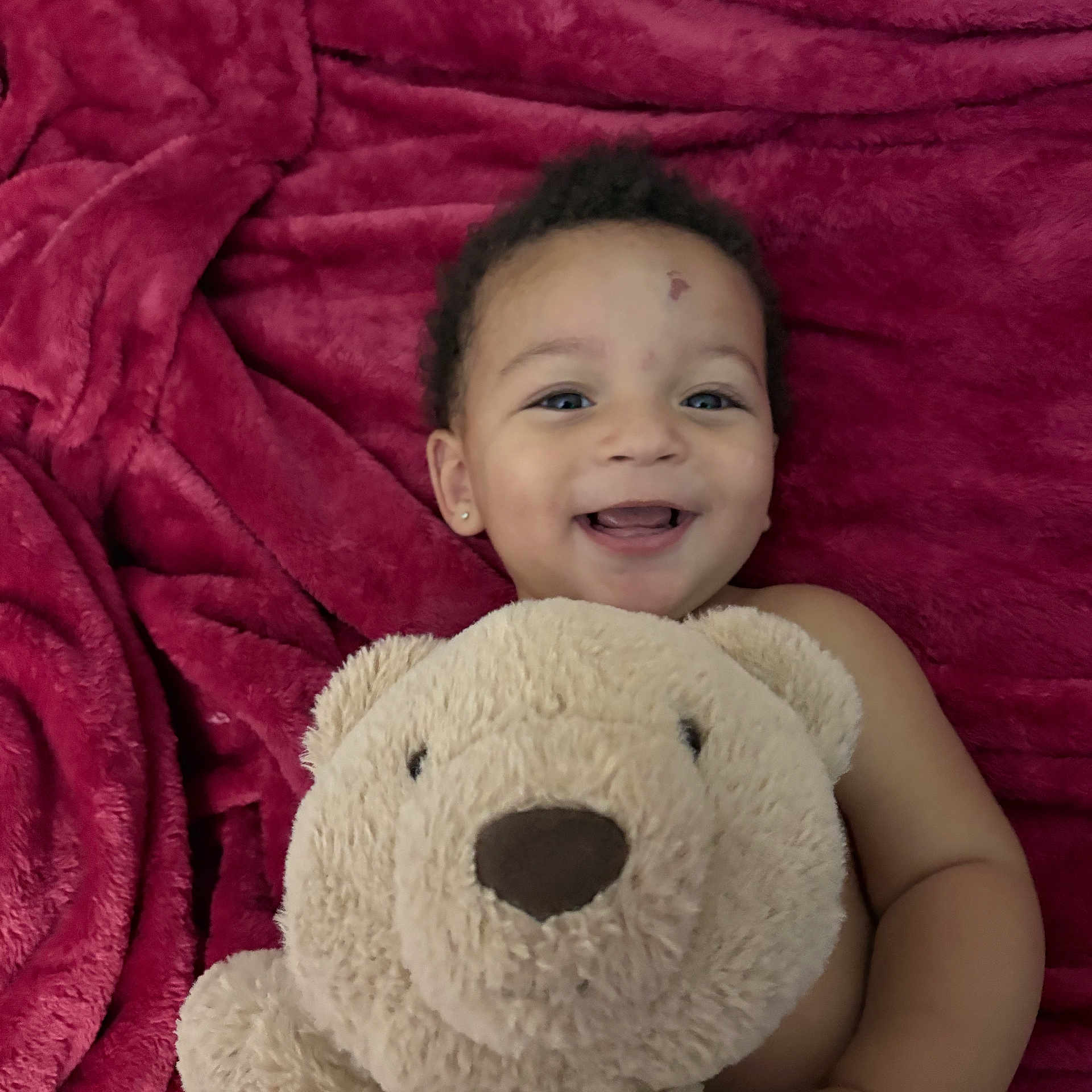 Princeton joined the competition — help win amazing prizes! baby, smile, teddy_bear, plush, blanket, child, happy, cute, portrait, indoor, soft_texture, cozy, infant, person, head, face, toy, earring, lying, young_child