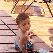 Princeton joined the competition — help win amazing prizes! toddler, child, curly_hair, swim_trunks, wooden_deck, outdoor, sunlight, water_bottle, plastic_bottle, metal_rod, folding_chairs, shadow, bare_chest, summer, sitting, looking_up, young_child, casual, daylight, backyard