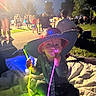 Princeton joined the competition — help win amazing prizes! child, hat, glowing_lights, night, outdoor, blanket, crowd, park, neon_sticks, people, grass, trees, sitting, fun, celebration, event, darkness, light_trails, casual_clothing, festival
