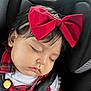 Astoria is registered to the contest to win money with this photo: baby, sleeping, car_seat, red_bow, infant, child, safety_harness, cute, peaceful, portrait, clothing, plaid, headband, young_child, resting, closeup, face, indoors, seatbelt, adorable