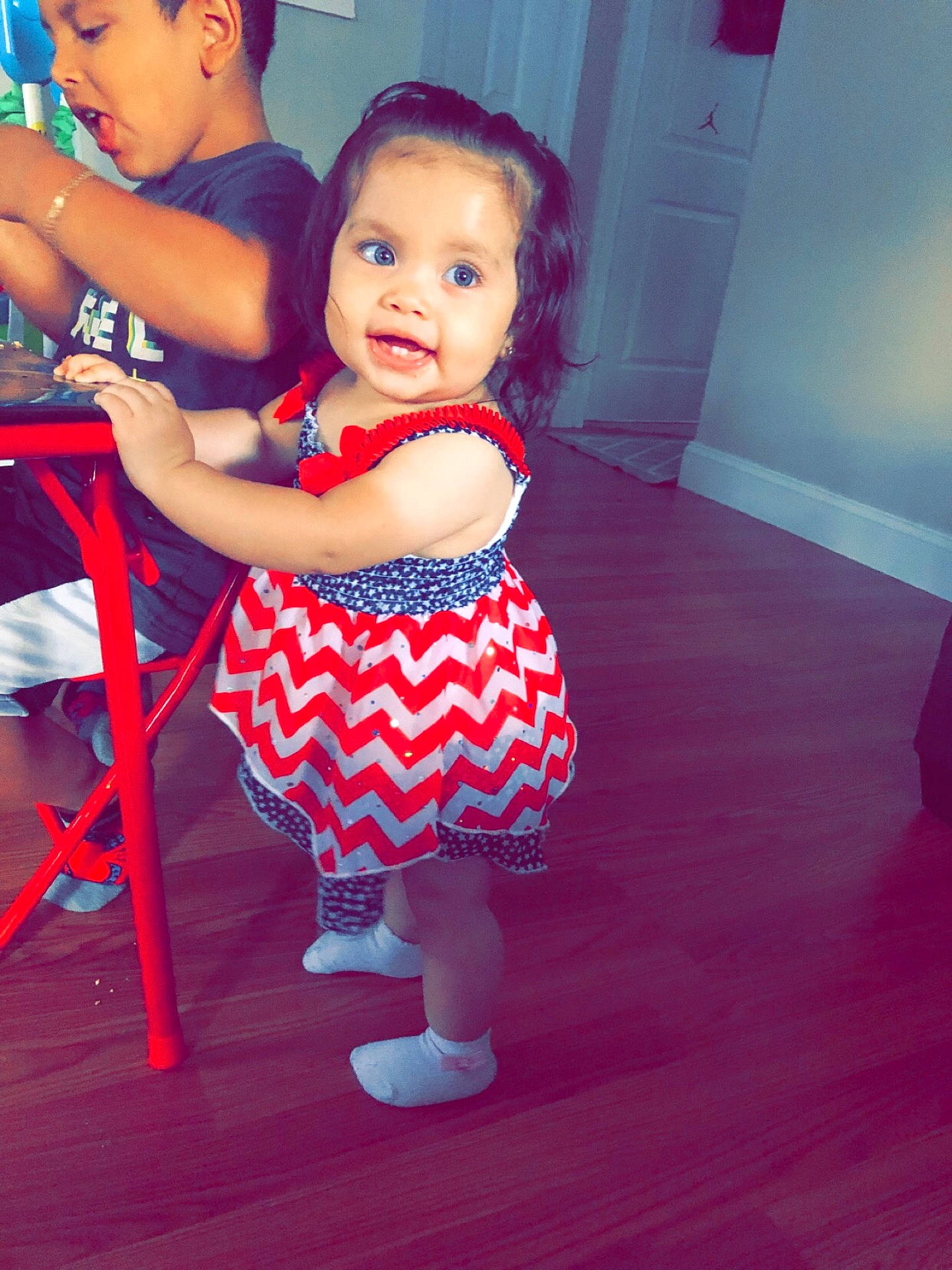 Amy is registered to the contest to win money with this photo: beauty, blue, child, clothing, day, fun, girl, infant, leg, organ, person, pink, product, purple, red, shoulder, sitting, skin, smile, standing