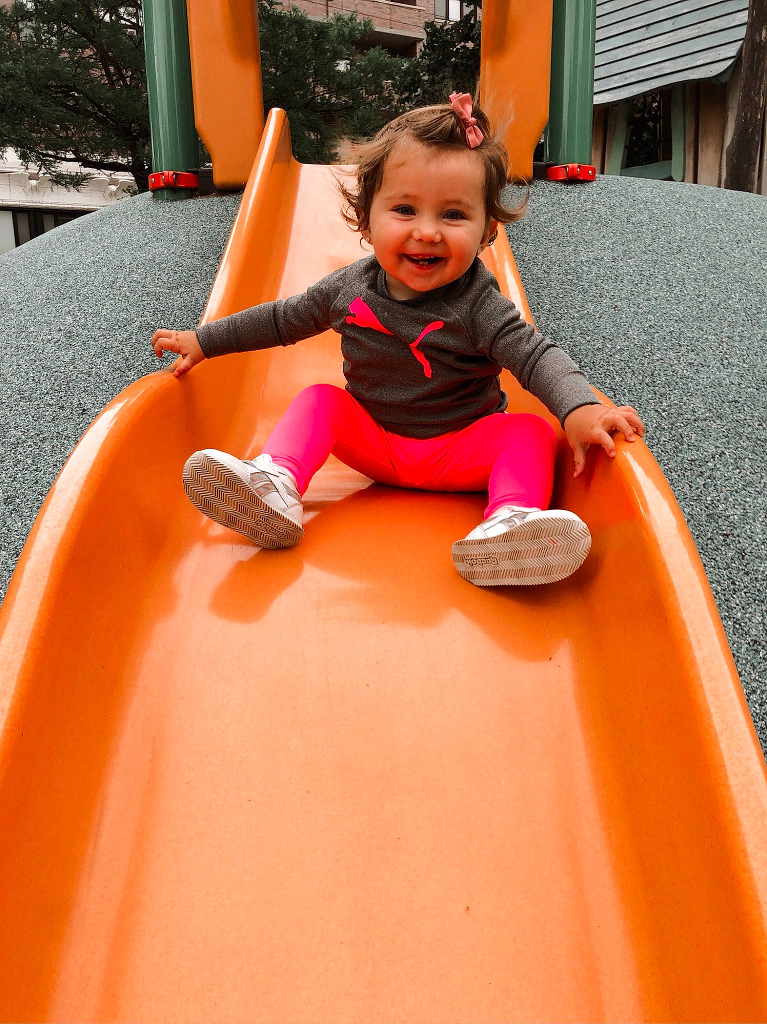 Leilah is registered to the contest to win money with this photo: chute, eye, face, fun, head, human_body, joy, leg, leisure, motor_vehicle, orange, person, pink, plant, playground, playground_slide, recreation, red, shoe, smile
