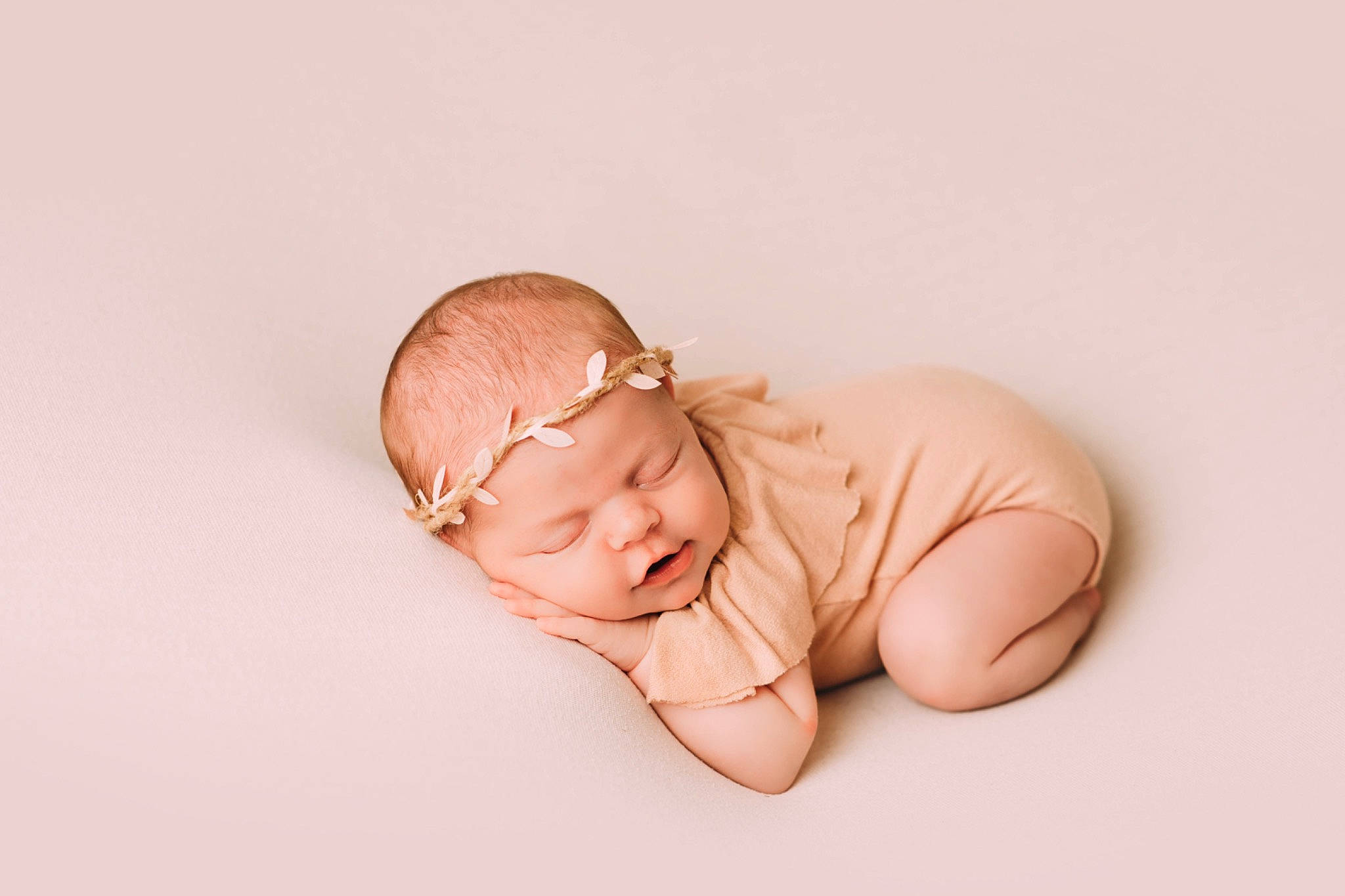 Ella is registered to the contest to win money with this photo: baby, baby_toddler_clothing, collar, comfort, fashion_accessory, flash_photography, foot, happy, headwear, human_body, jewellery, nail, peach, person, portrait_photography, sitting, sleeve, stomach, thumb, toddler