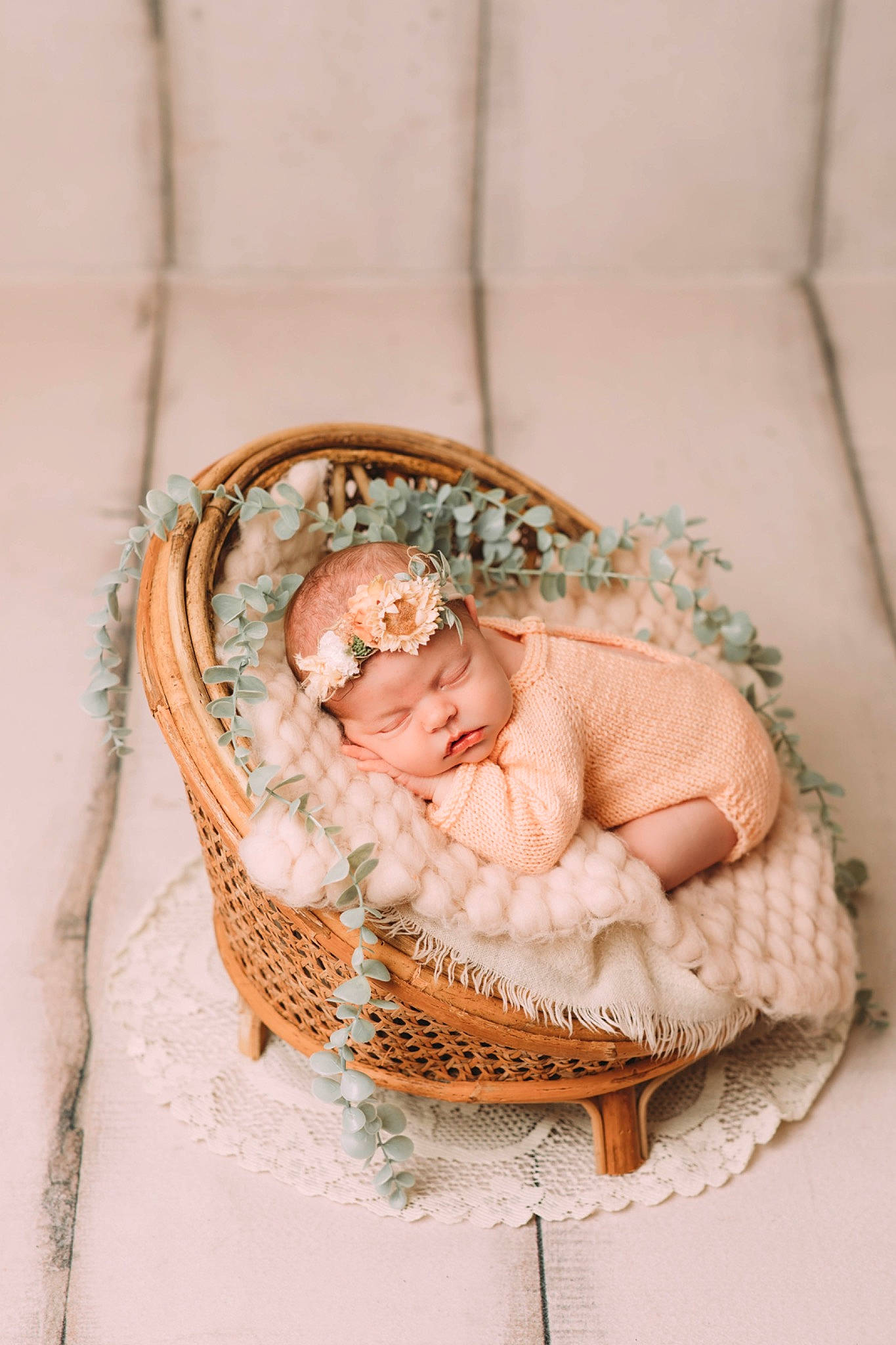 Ella is registered to the contest to win money with this photo: baby, baby_products, baby_toddler_clothing, basket, child, comfort, fashion_accessory, hair_accessory, headgear, headpiece, headwear, home_accessories, infant_bed, jewellery, pattern, peach, person, plant, sitting, toddler