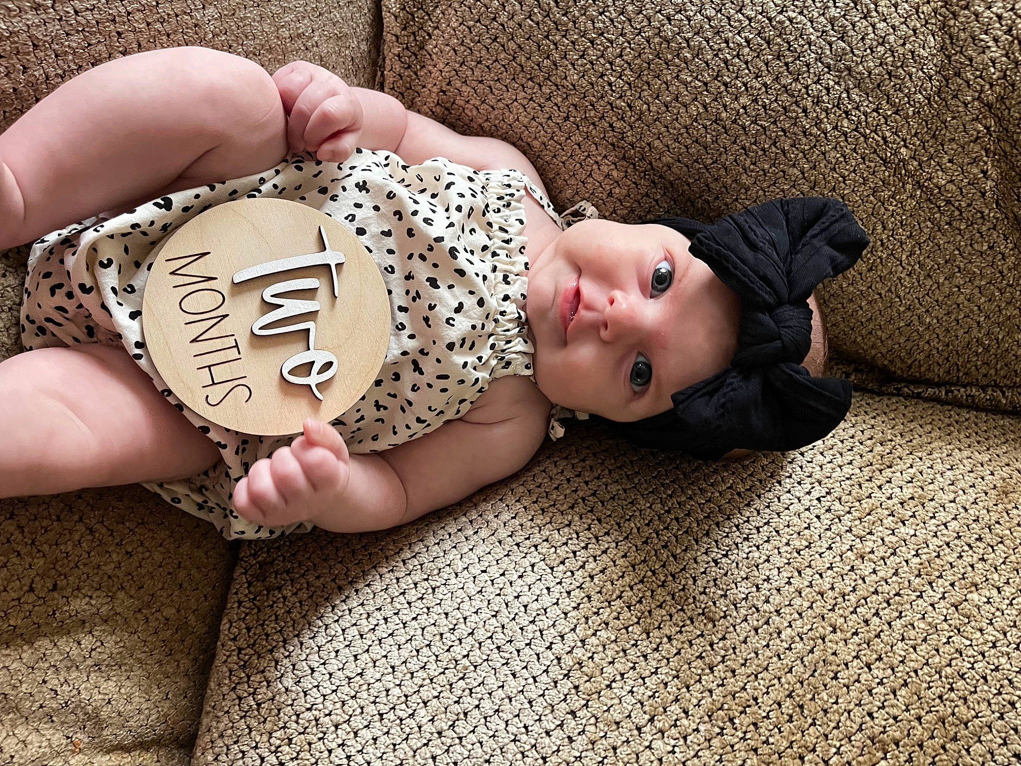 Ella is registered to the contest to win money with this photo: baby_sleeping, baby_toddler_clothing, comfort, eye, fawn, flooring, glasses, head, headgear, headwear, human_body, human_leg, leg, pattern, person, skin, thigh, toddler, trunk, waist