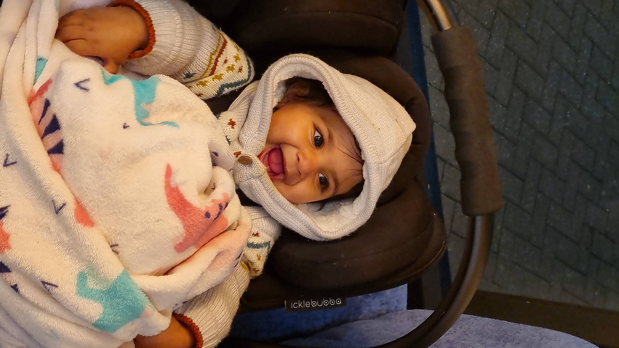 Kiara is registered to the contest to win money with this photo: baby, baby_products, baby_safety, baby_toddler_clothing, cheek, child, childbirth, comfort, eye, hat, headwear, linens, nail, nap, nose, person, room, sitting, skin, sleep