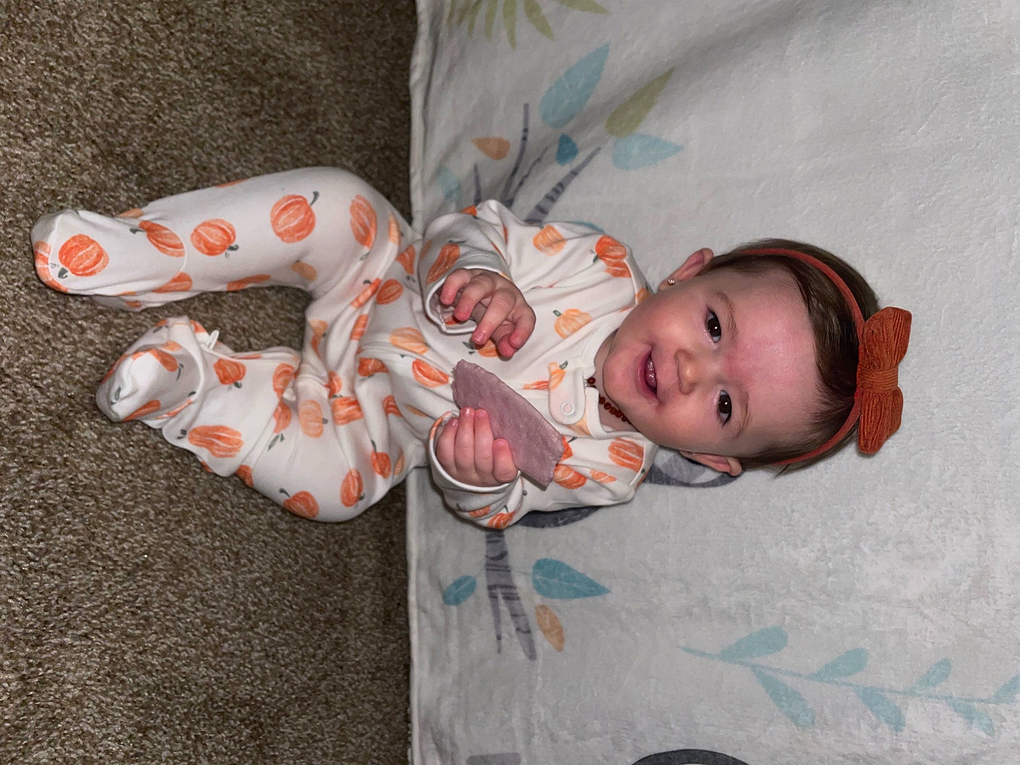 Paizlee is registered to the contest to win money with this photo: baby, baby_products, baby_toddler_clothing, carmine, cheek, child, comfort, eye, fun, linens, pattern, person, personal_protective_equipment, room, sleeve, toddler