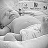Aubrey joined the competition — help win amazing prizes! baby, sleeping, infant, diaper, foot, hand, face, black_and_white, soft, blanket, baby_wipes, peaceful, newborn, rest, cute, closeup, skin, lying_down, indoors, comfort
