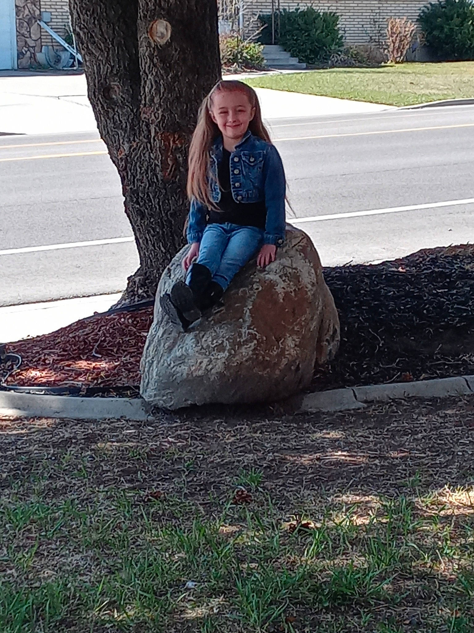 Freedom is registered to the contest to win money with this photo: asphalt, denim, grass, hat, jeans, joy, knee, leisure, people_in_nature, person, plant, recreation, road_surface, rock, sitting, smile, soil, t_shirt, tints_and_shades, tree