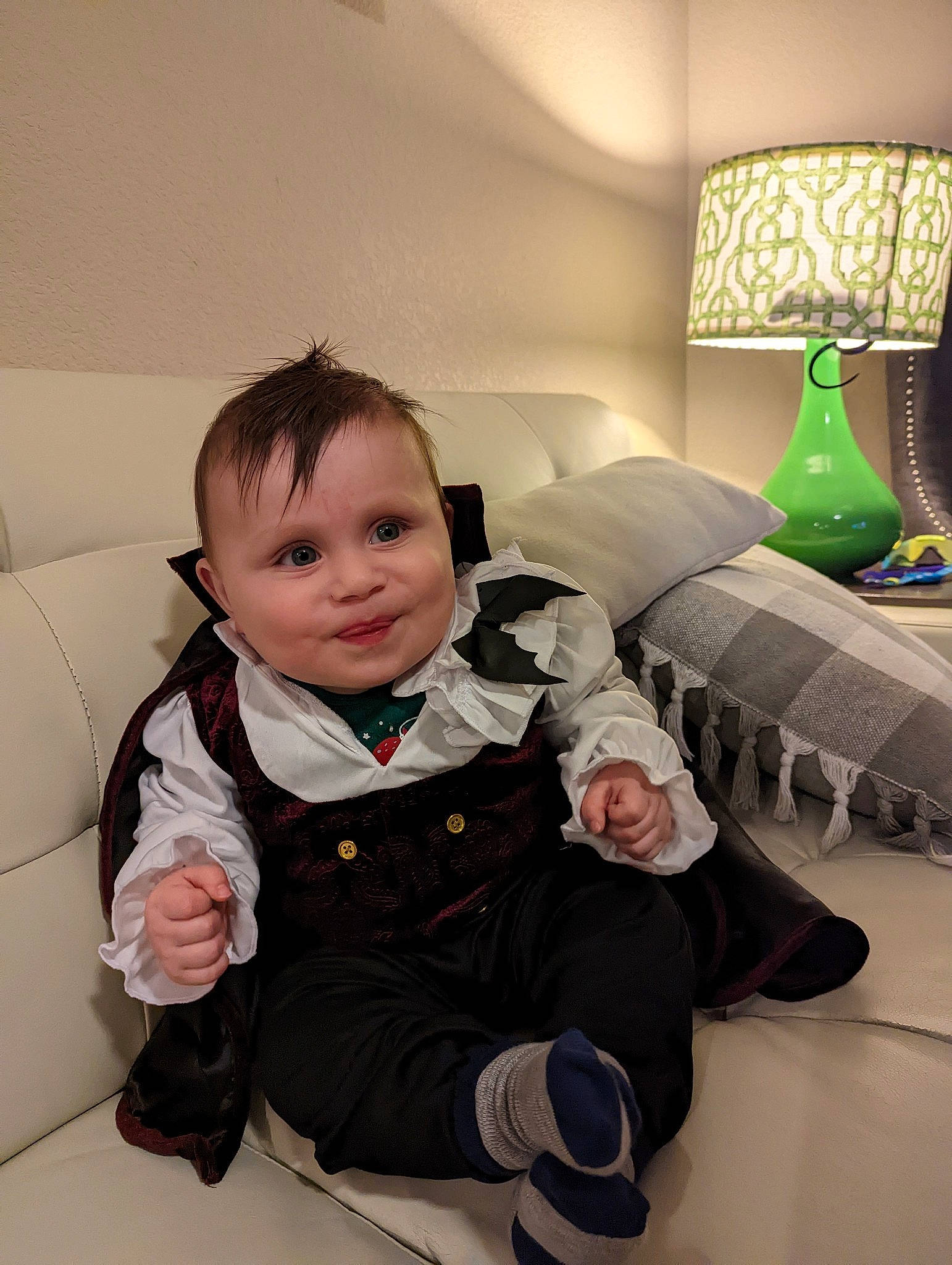 Cassius joined the competition — help win amazing prizes! baby, baby_toddler_clothing, child, comfort, couch, floor, flooring, fun, fur, happy, hardwood, lamp, living_room, person, room, sitting, sleeve, smile, studio_couch, toddler