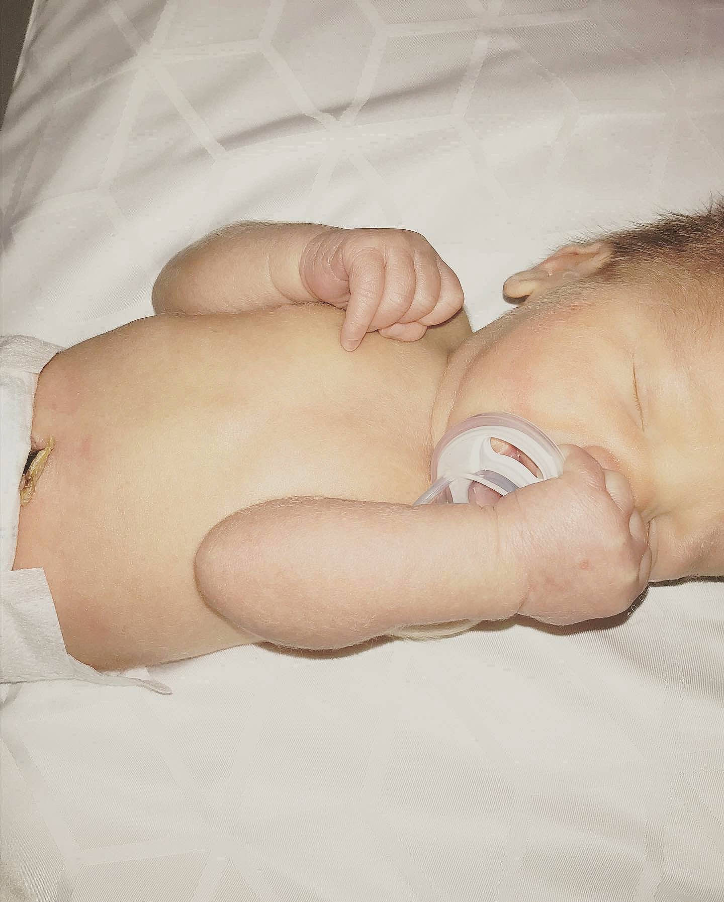 Luka is registered to the contest to win money with this photo: arm, baby, baby_sleeping, baby_toddler_clothing, child, comfort, elbow, event, finger, flesh, foot, gesture, hand, human_leg, linens, nail, person, skin, thumb, toddler