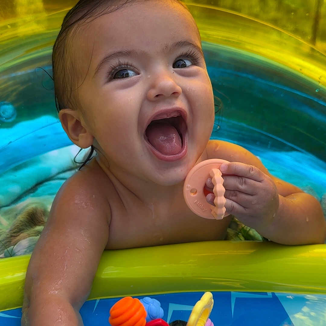 Baker joined the competition — help win amazing prizes! baby, child, colorful, cute, expression, face, fun, hand, happy, inflatable, outdoor, play, pool, skin, smile, splash, summer, teething_toy, toy, water