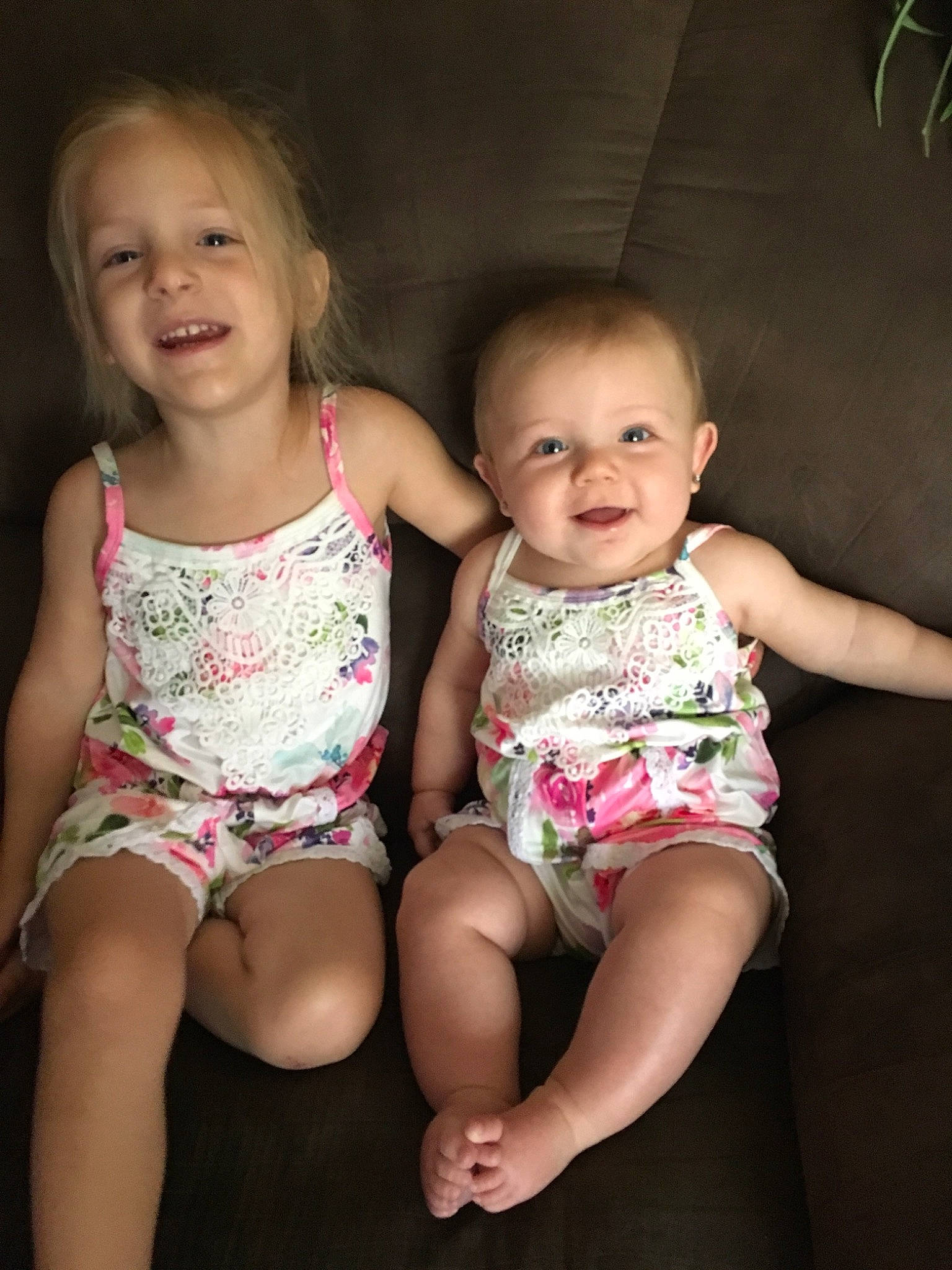 Emmalyn joined the competition — help win amazing prizes! baby, cheek, child, dress, eye, face, facial_expression, fun, head, human, iris, leg, people, person, pink, sibling, sitting, skin, smile, standing