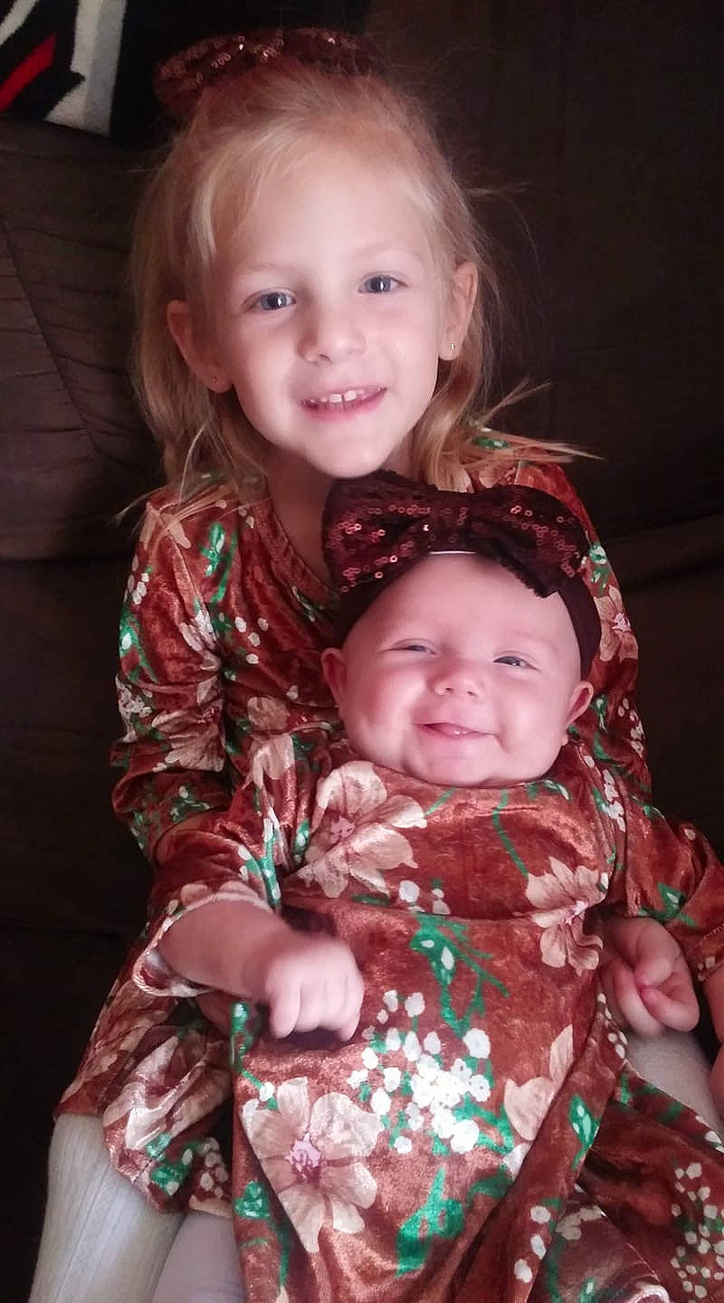 Taylor is registered to the contest to win money with this photo: baby, cheek, child, daughter, eye, face, family, happy, iris, joy, people, person, sibling, sitting, skin, smile, toddler