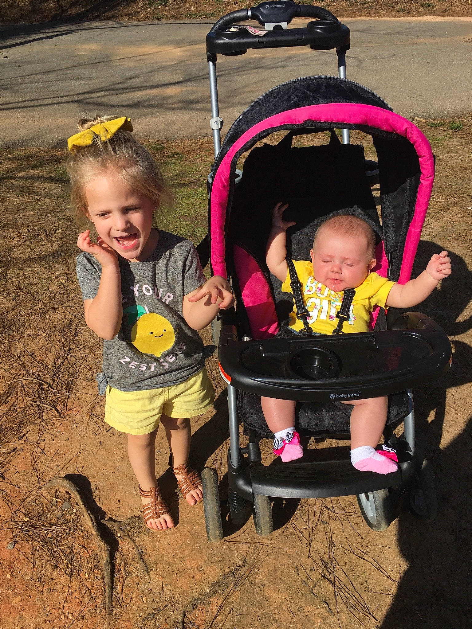 Taylor is registered to the contest to win money with this photo: baby_carriage, baby_products, child, fun, person, pink, play, product, smile, toddler, vacation, vehicle