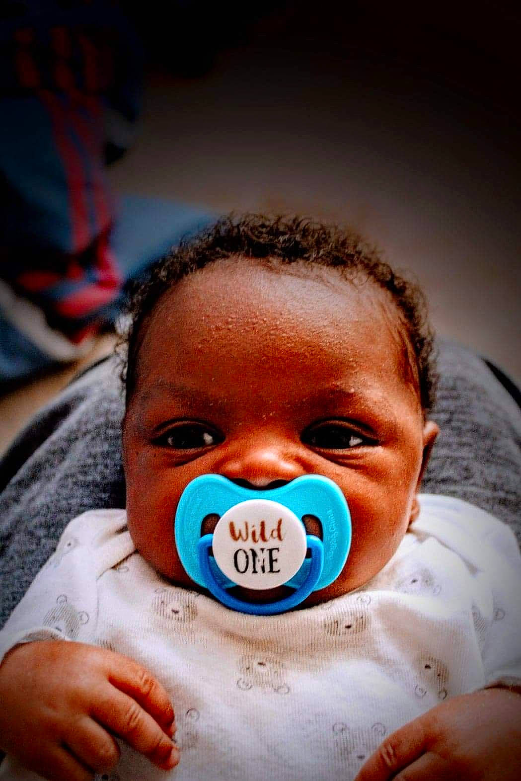 Carmelo is registered to the contest to win money with this photo: azure, baby, cheek, chin, ear, eyebrow, eyelash, facial_expression, finger, flash_photography, gesture, happy, head, iris, lip, mouth, nose, person, product, skin