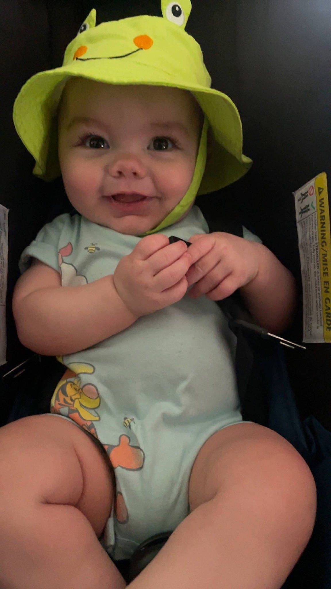 Everett is registered to the contest to win money with this photo: baby, baby_toddler_clothing, cap, cheek, eye, face, facial_expression, finger, hairstyle, hand, hard_hat, hat, headwear, human_body, joy, mammal, organ, person, product, skin