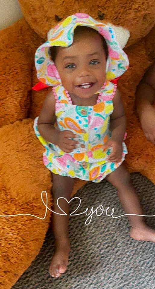 Azyiah joined the competition — help win amazing prizes! child, eye, face, fun, happy, head, human_body, human_leg, joy, leg, leisure, magenta, person, pink, play, shorts, sitting, skin, smile, t_shirt