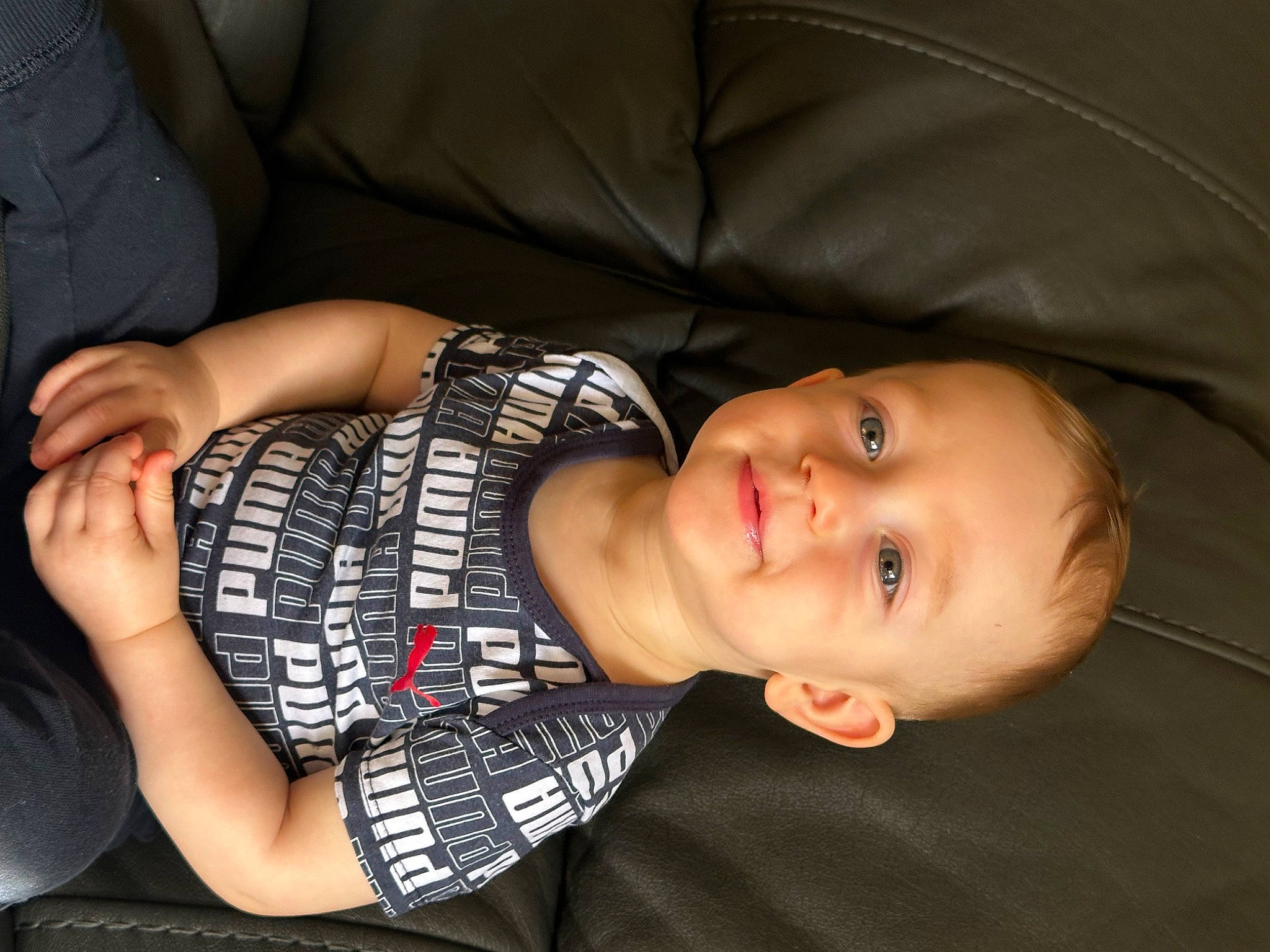 Enrique joined the competition — help win amazing prizes! baby, cheek, comfort, couch, elbow, gesture, glasses, hand, human_body, joy, lip, mammal, mouth, nose, person, skin, sleeve, smile, tartan, toddler
