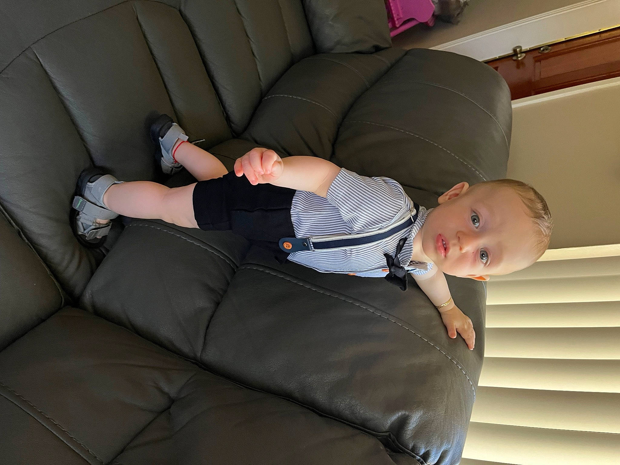 Enrique is registered to the contest to win money with this photo: auto_part, baby, baby_toddler_clothing, car_seat, child, comfort, couch, furniture, human_leg, knee, lap, linens, luxury_vehicle, person, room, sitting, studio_couch, surprise, thigh, toddler
