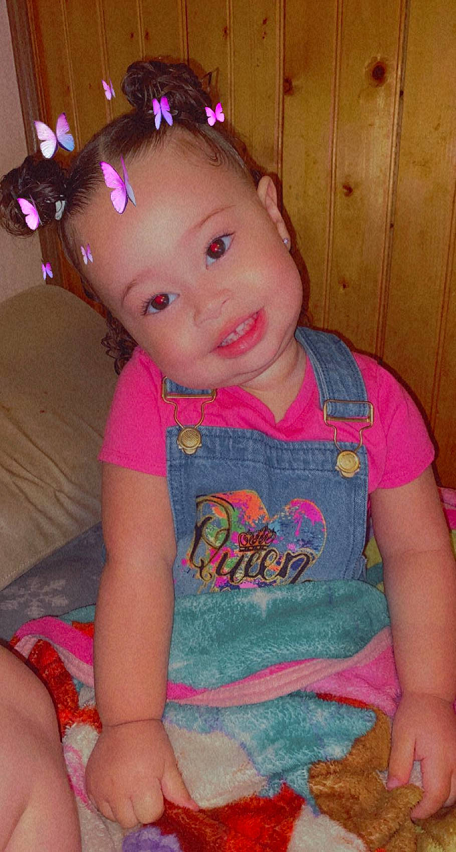 Avyanna is registered to the contest to win money with this photo: baby_toddler_clothing, cheek, chin, eye, eyebrow, forehead, hair, hairstyle, head, iris, joy, lip, mouth, neck, nose, person, pink, purple, skin, sleeve