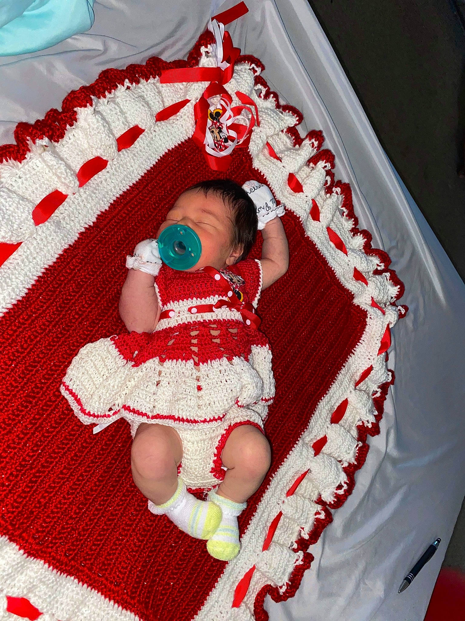 Avyanna joined the competition — help win amazing prizes! baby, baby_products, baby_sleeping, baby_toddler_clothing, carmine, child, comfort, event, fictional_character, linens, magenta, pattern, person, pink, red, room, sitting, sleeve, sock, textile