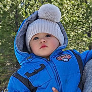 Von joined the competition — help win amazing prizes! baby, blue_jacket, bundle_up, child, cold_weather, curious_expression, cute, forest, hand, nature, outdoor, person, pom_pom_hat, portrait, support, toddler, trees, warm_clothes, winter_clothing, young_child