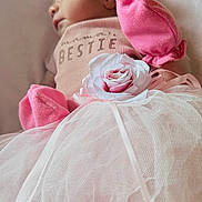 Kiya joined the competition — help win amazing prizes! baby, sleeping, pink, headband, flower, tulle, skirt, closeup, soft, cute, infant, small, clothing, fabric, portrait, peaceful, child, newborn, resting, delicate