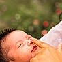 baby, infant, face, skin, finger, touch, close_up, purple_clothing, lace, peaceful, outdoor, nature, person, head, newborn, cute, expression, soft_light, portrait, human