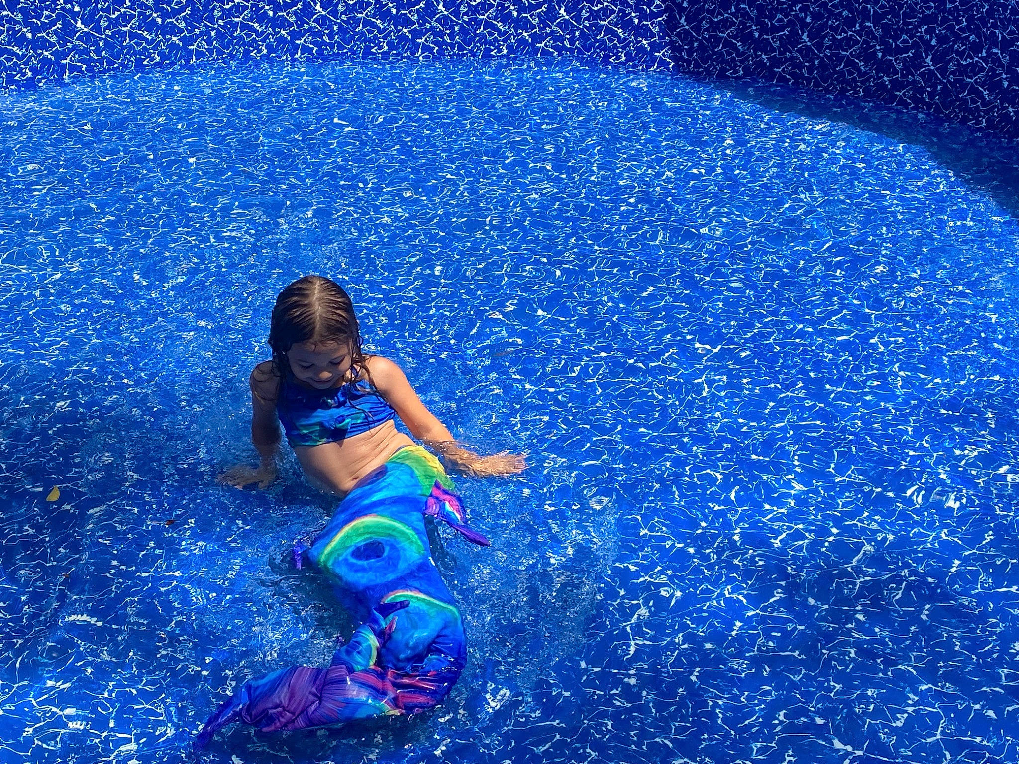 Skylee is registered to the contest to win money with this photo: astronomical_object, azure, blue, electric_blue, fun, grass, happy, human_leg, landscape, leisure, ocean, people_in_nature, person, recreation, sky, space, toddler, toy, water, wave