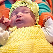 Rosalia participe au concours pour gagner de l'argent avec cette photo : newborn, baby, sleeping, yellow, knitted, hat, bow, blanket, cozy, soft, infant, child, cute, resting, clothing, portrait, closeup, hand, face, peaceful