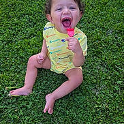 Jayden joined the competition — help win amazing prizes! toddler, child, grass, outdoor, yellow_clothing, happy, smiling, toy, sitting, barefoot, curly_hair, person, playful, greenery, summer, cute, fun, youth, innocence, cheerful