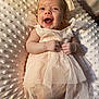 baby, infant, dress, headband, smile, happy, blanket, soft_texture, tulle, cute, portrait, lying_down, skin, hand, foot, indoor, child, fashion, adorable, person
