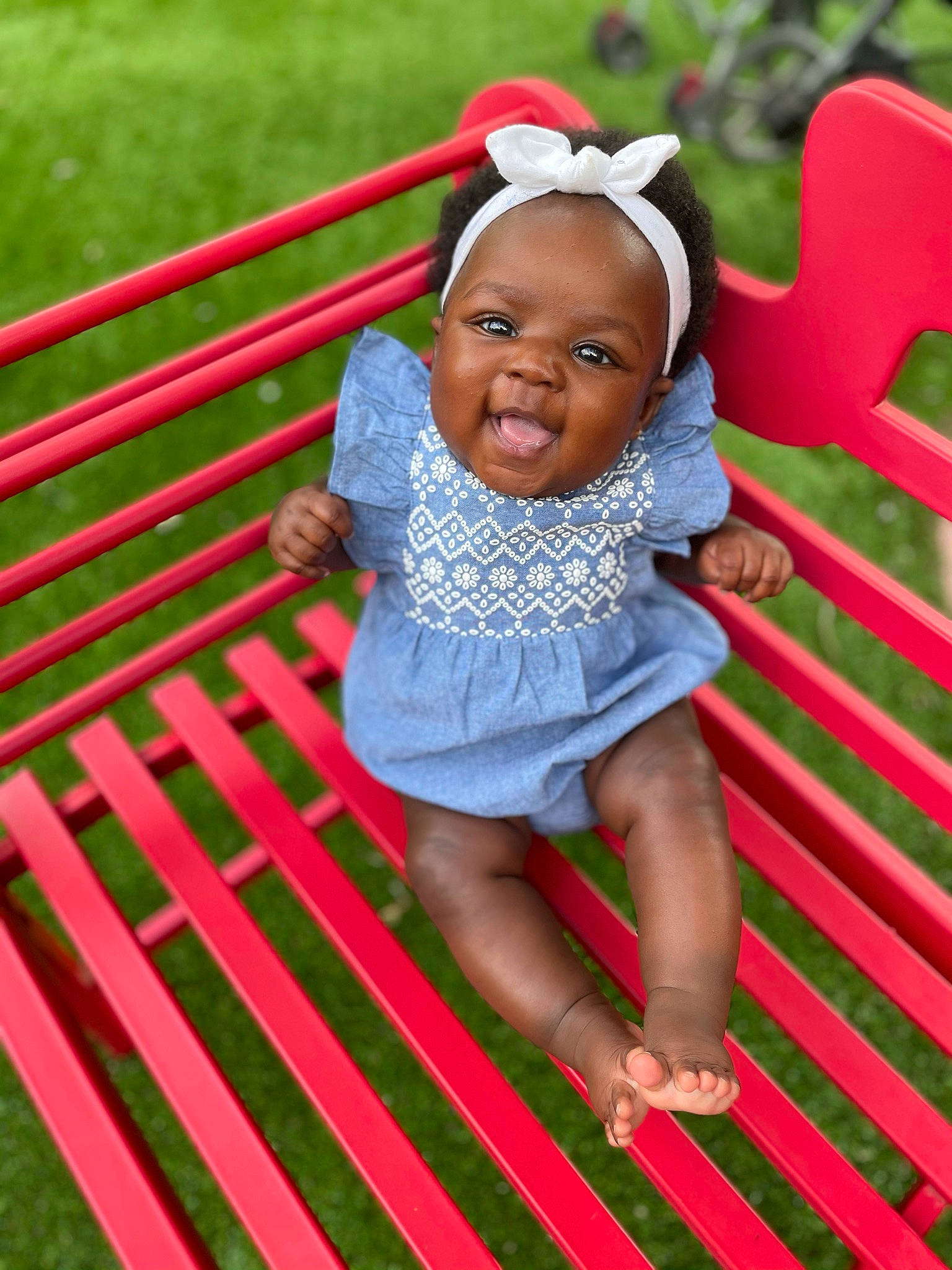 Zaire joined the competition — help win amazing prizes! baby, baby_toddler_clothing, clothing, dress, fun, grass, happy, leisure, magenta, outdoor_furniture, people_in_nature, person, pink, product, recreation, red, skin, sleeve, smile, summer