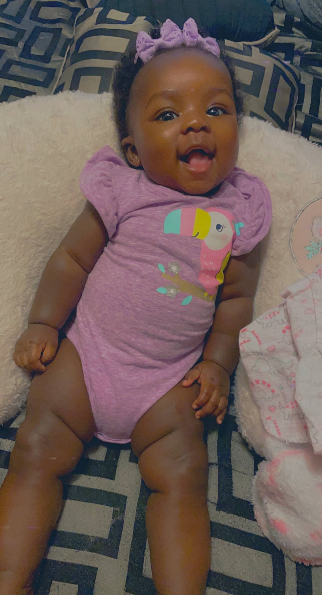 Zaire is registered to the contest to win money with this photo: baby, baby_toddler_clothing, cheek, chin, eye, eyebrow, face, facial_expression, head, iris, leg, lip, mouth, neck, nose, organ, person, pink, skin, sleeve
