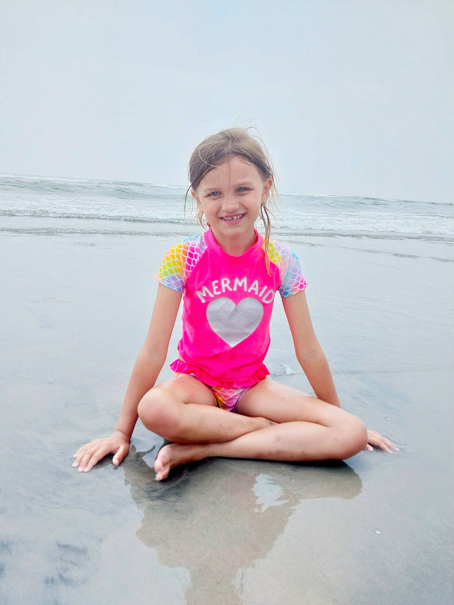 Jayde is registered to the contest to win money with this photo: baby_toddler_clothing, barefoot, beach, eye, foot, fun, happy, joy, leisure, person, pink, sand, shirt, shorts, sky, sleeve, smile, t_shirt, thigh, toddler