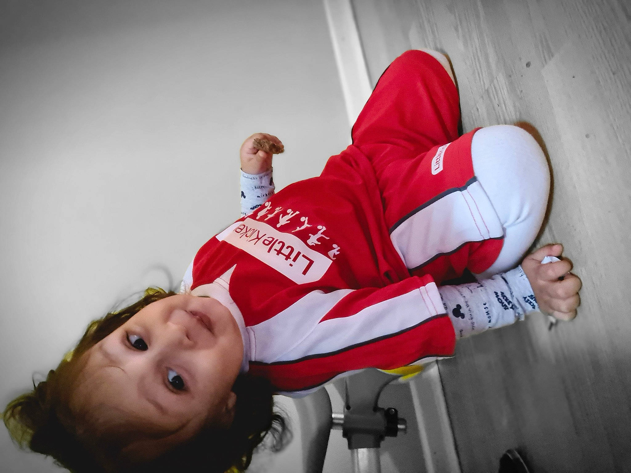 Noah is registered to the contest to win money with this photo: carmine, child, elbow, event, flash_photography, flesh, font, fun, gesture, happy, human_leg, person, red, room, shorts, sleeve, smile, sports_uniform, sportswear, t_shirt